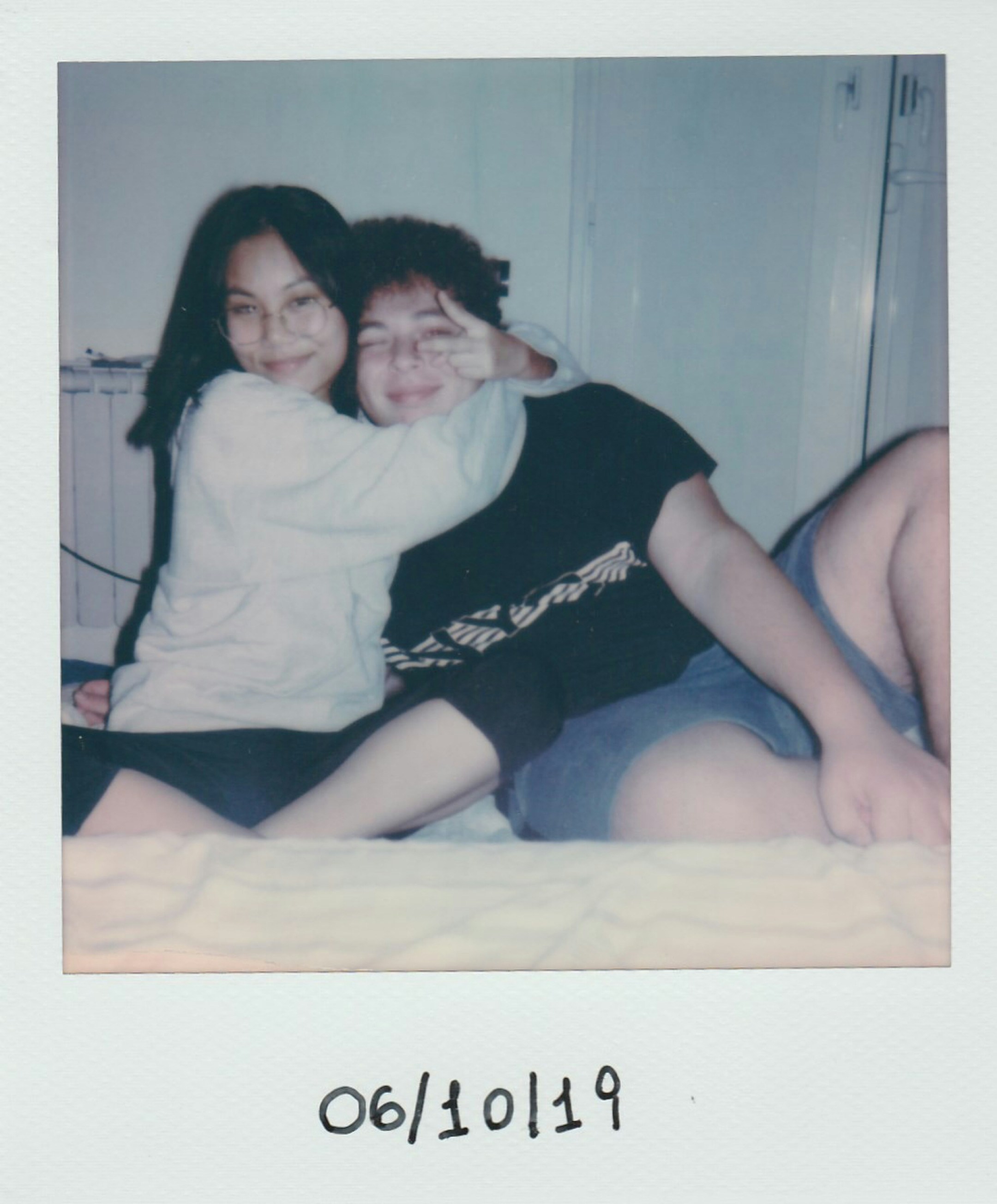 Polaroid photo of Georgia and Oli posing together