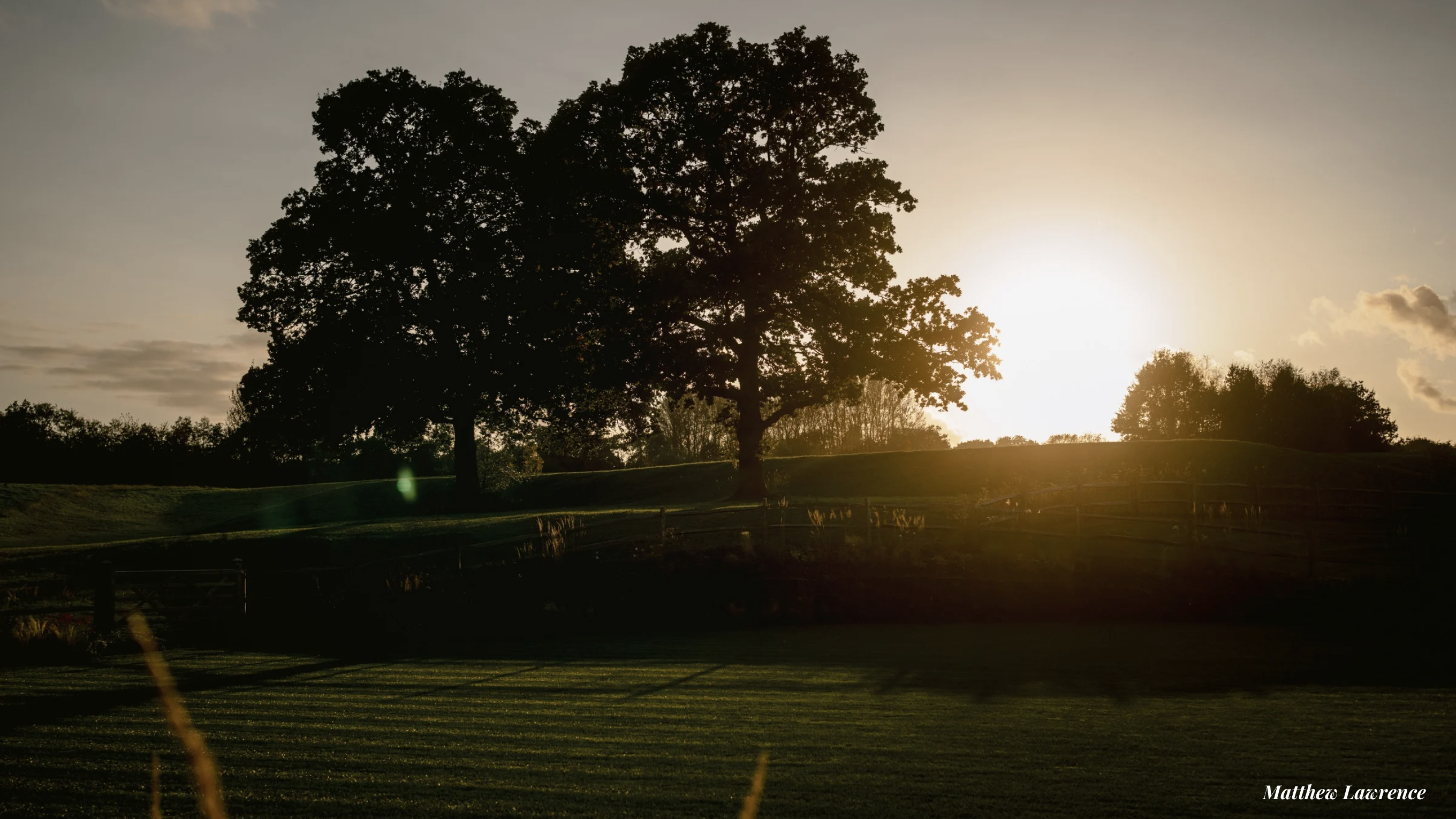 Cropped photo of the exterior of the top floor of an old stone building.